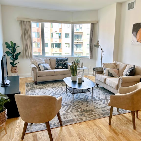 a living room with two couches, a coffee table, and a chair.
