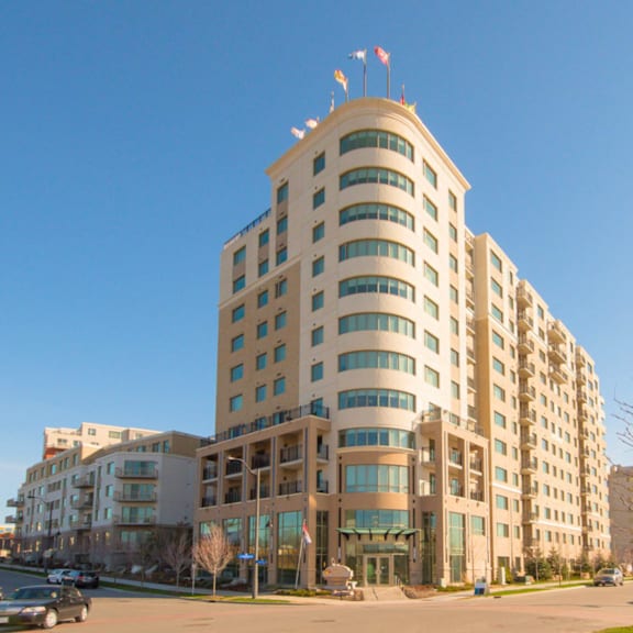 a large, modern building with a curved design and many windows.