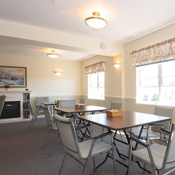 a dining room with a table and chairs.
