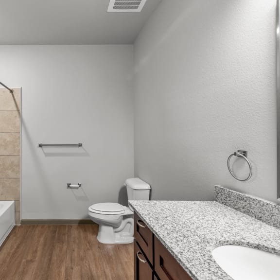 Thumbnail 6 of 7 a bathroom with a toilet and a shower and a sink