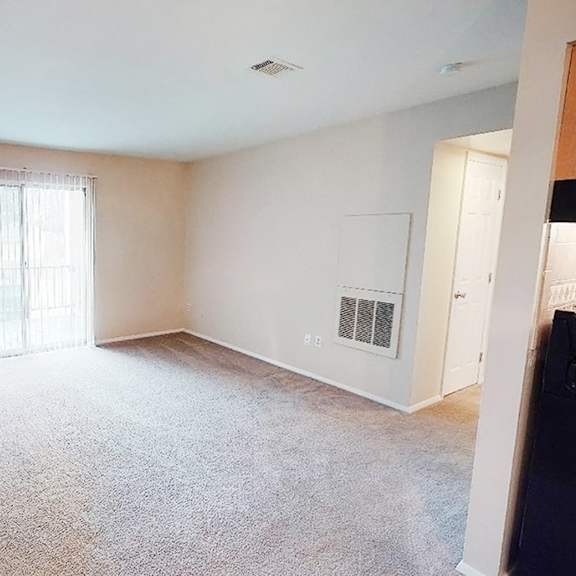 living room with balcony at crown ridge apartments, ohio, 45005