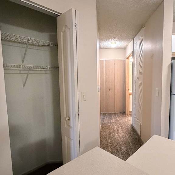 a white refrigerator is in the kitchen.