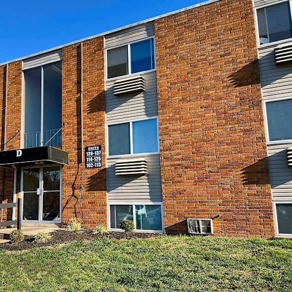 the front of a brick building with a porch at barkley ridge apartments, kentucky, 41071