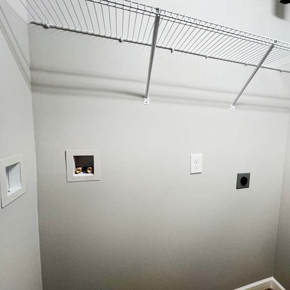 a room with white walls and a wire rack on the ceiling  at brookfield village apartments, ohio, 43123