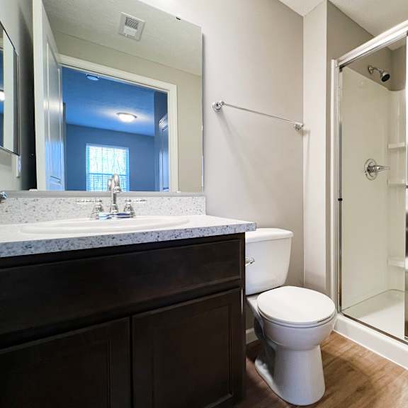 a bathroom with a shower and a sink and a toilet at brookfield village in grove city, oh