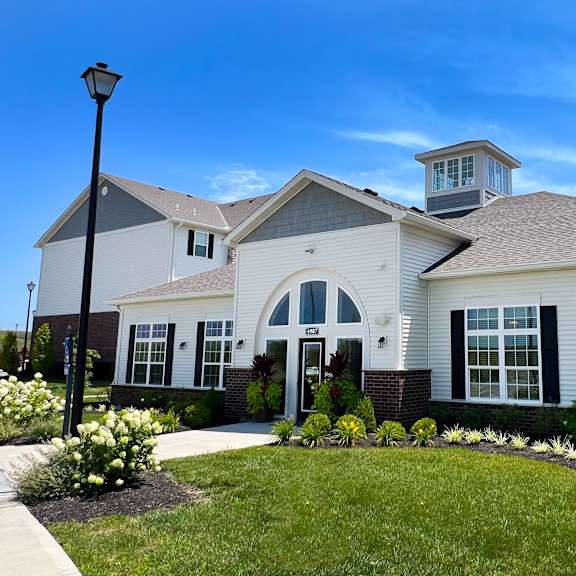 a white house with a yard and a street light at parkway trails, florence, 41042