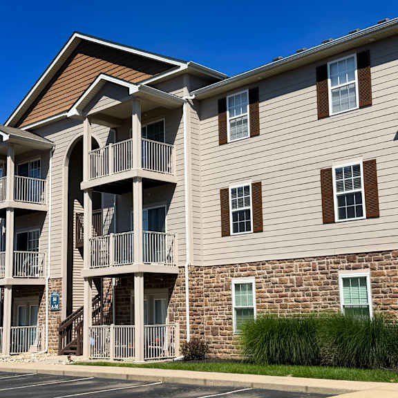 apartment building with a blue sign that says 70.