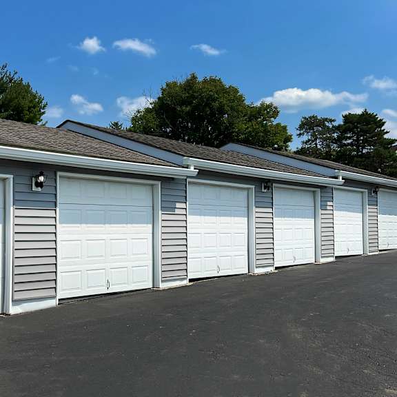 a row of garage doors on the side of a building at deercross apartments, cincinnati, 45236