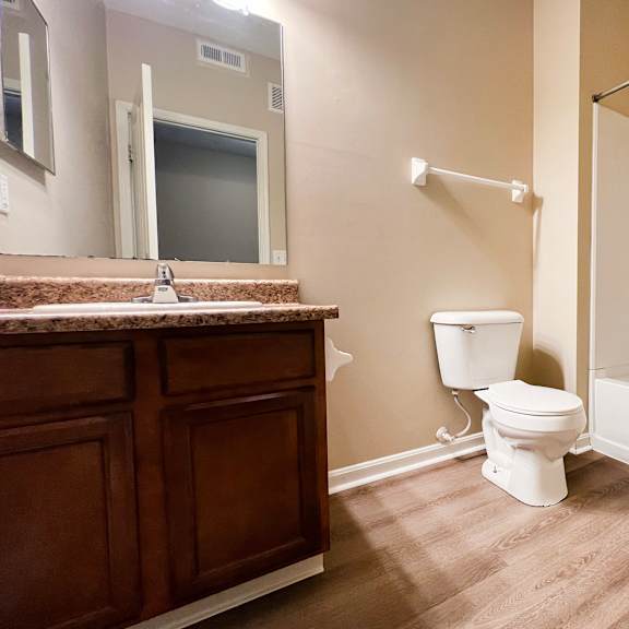 a bathroom with a toilet and a sink and a shower at liberty crossing, columbus, 43235