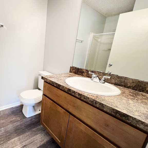 an empty bathroom with a sink and a toilet at eagle crest apartments, galloway