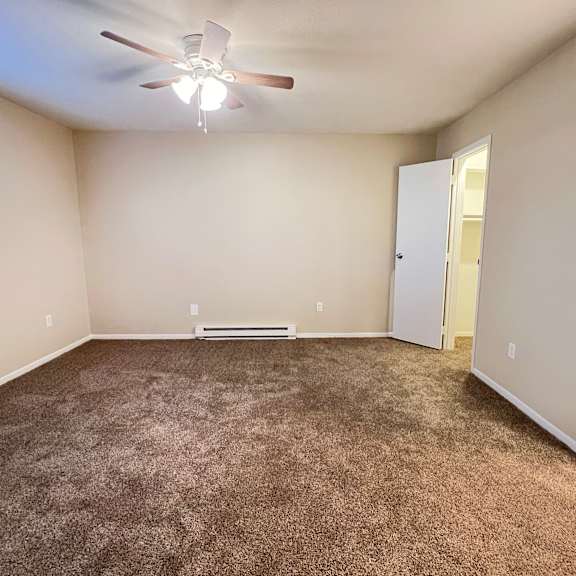 an empty room with carpet and a ceiling fan at hunter ridge apartments, cincinnati, oh, 45244