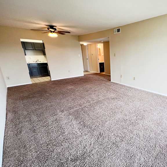 empty living room with carpet at indian lookout apartments, cincinnati, oh