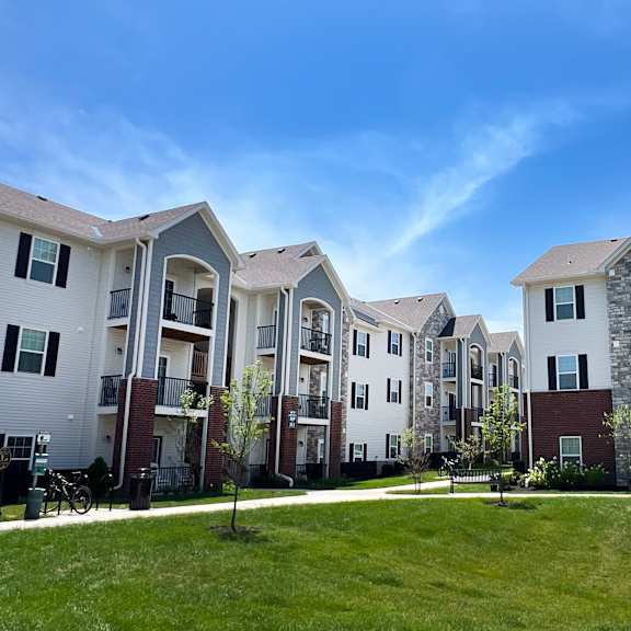 a row of apartment buildings on a sunny day at parkway trails, florence