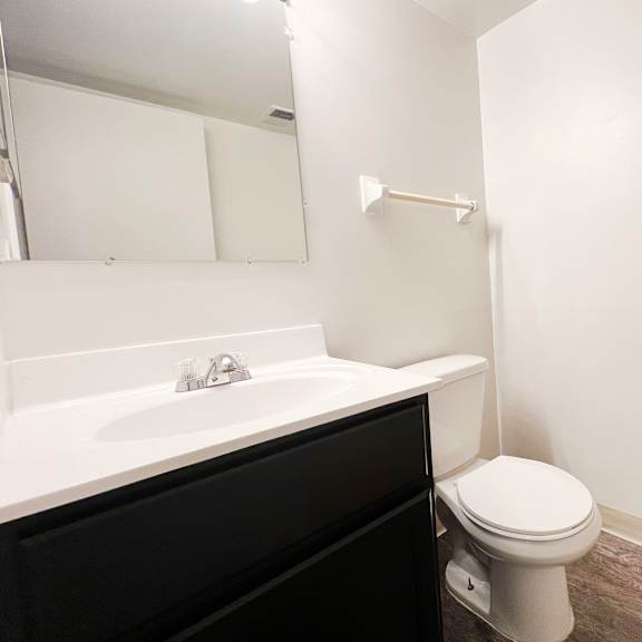 an empty bathroom with a toilet and a sink at indian lookout apartments, cincinnati, oh, 45238