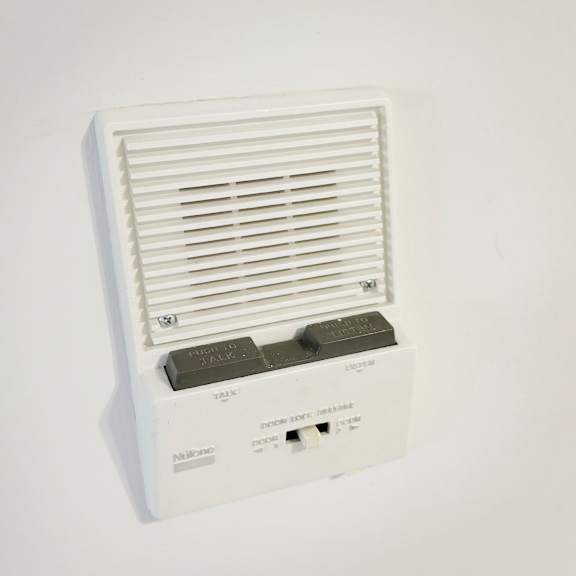 a wall-mounted air conditioner unit with a remote control.