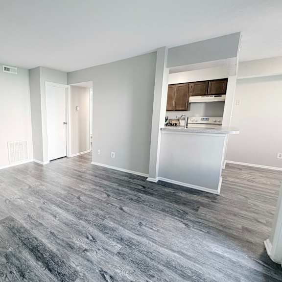a room with a grey floor and white walls.
