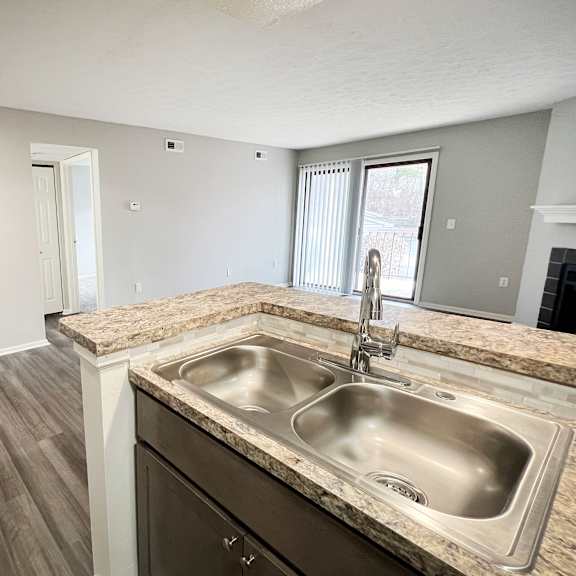 an empty kitchen with a sink and a window  at deercross apartments, cincinnati, oh, 45236