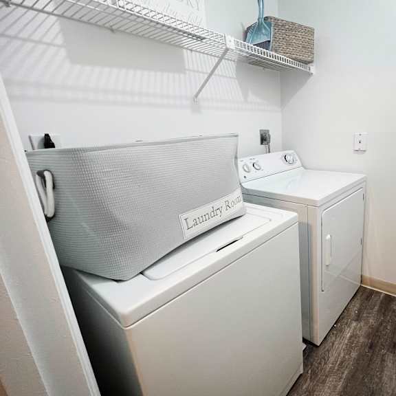 a small laundry room with a washer and dryer  at steeplechase apartments, loveland, 45140