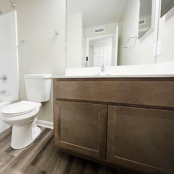 a bathroom with a toilet sink and bathtub at crown ridge apartments, ohio, 45005