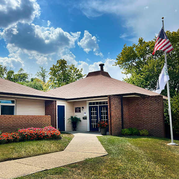 a house with a flag in front of it at fox run apartments, cincinnati