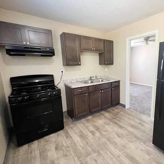 kitchen with black appliances at crown court apartments, kentucky