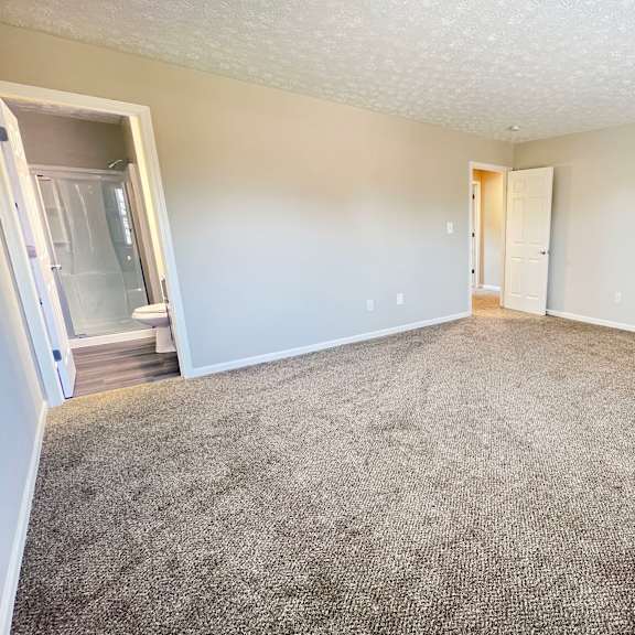 beige carpet in bedroom  at revere village apartments, ohio, 45458