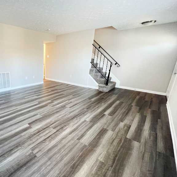 contemporary finishes include wood and tile flooring  at revere village apartments, ohio