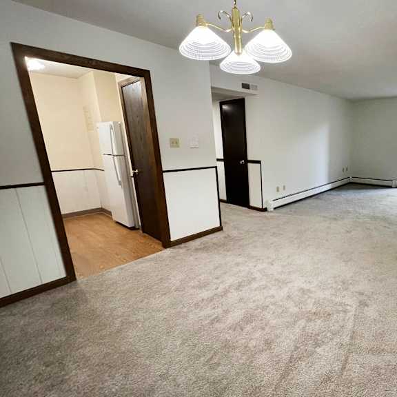 an empty living room with a carpeted floor and a window  at grace court, kentucky, 41017