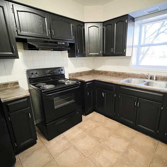 kitchen with black appliances at park place, kentucky, 40475