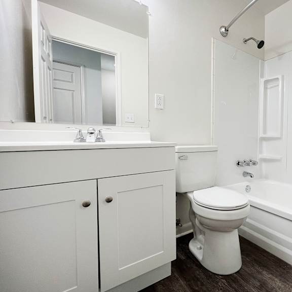 a bathroom with a toilet sink and bathtub at wentworth estates apartments, florence, ky