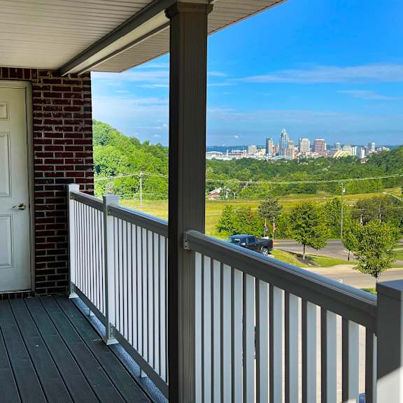 a balcony with a door and a view of a city  at the overlook at ft. thomas, ft. thomas, ky
