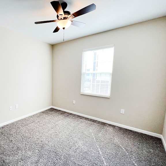 a bedroom with a ceiling fan and a window at parkway trails, kentucky