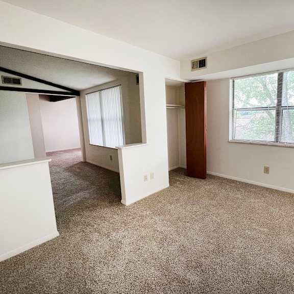 an empty room with a large window  at four worlds apartments, cincinnati, ohio