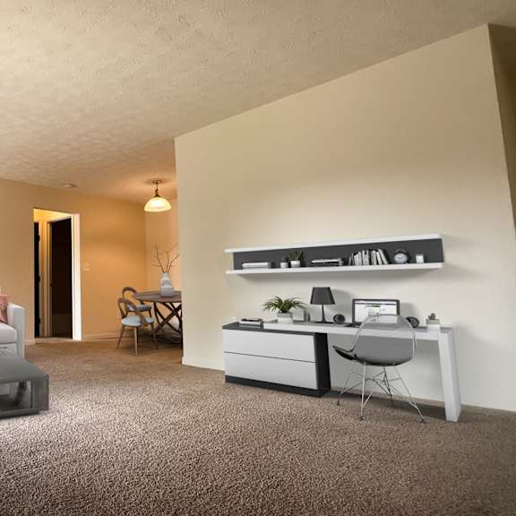 a living room with a couch and a coffee table at four worlds apartments, cincinnati, oh 45231
