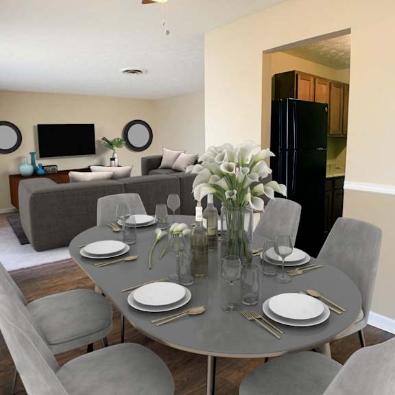 a dining room and living room with a table and chairs  at timber ridge apartments, ohio