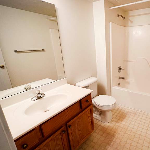 a bathroom with a sink toilet and a shower  at walton ridge apartments, walton, kentucky