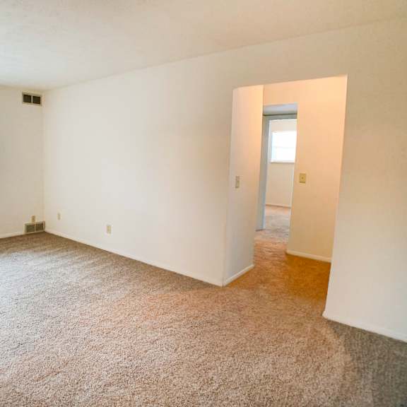 carpeted living area at four worlds apartments, cincinnati