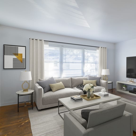 a living room with a couch and a coffee table at Ann Street Lofts, Mobile, 36604