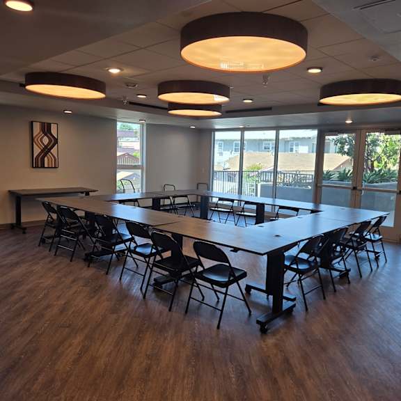a conference room with a long table and chairs.