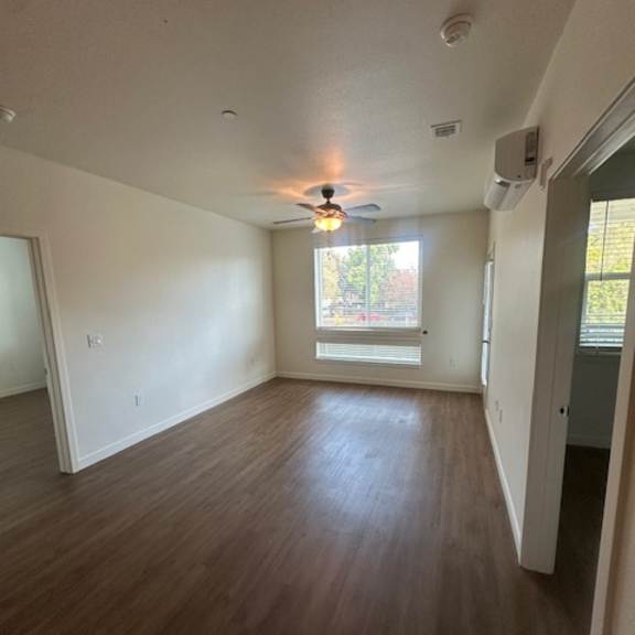 a long white table is in a room with wood paneling.