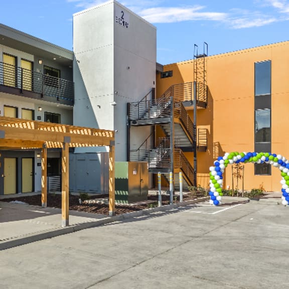 a building with a yellow and blue archway entrance.