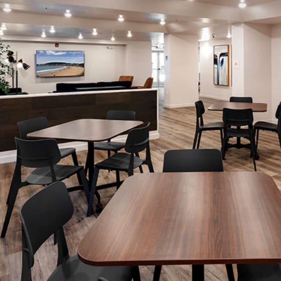 a conference room with a long table surrounded by chairs.