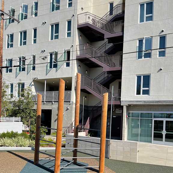 a modern building with a staircase and a balcony.