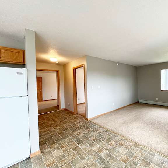 a room with a tile floor and a window.
