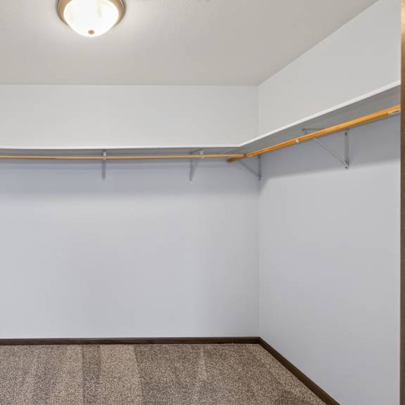 a room with a carpeted floor and a white wall.