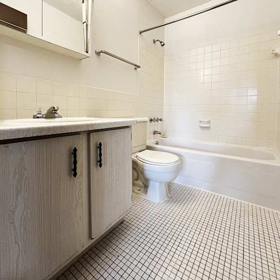 an empty bathroom with a toilet and a sink