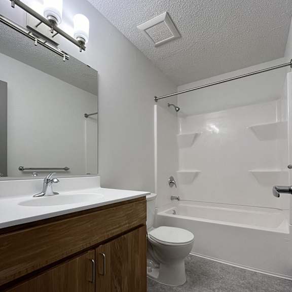 the preserve at ballantyne commons bathroom with toilet sink and shower