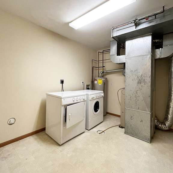 a laundry room with a washer and dryer.