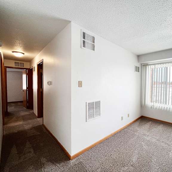a room with a window and a door.