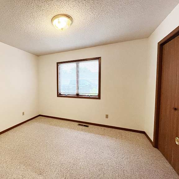 a room with a window and a door.